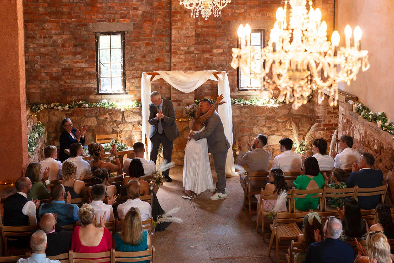 bride and groom kissing at exmouth country lodge wedding venue