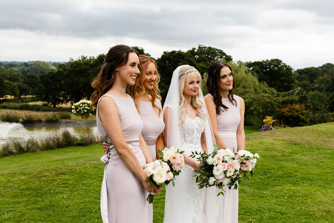 bride and bridesmiads at upton barn wedding venue