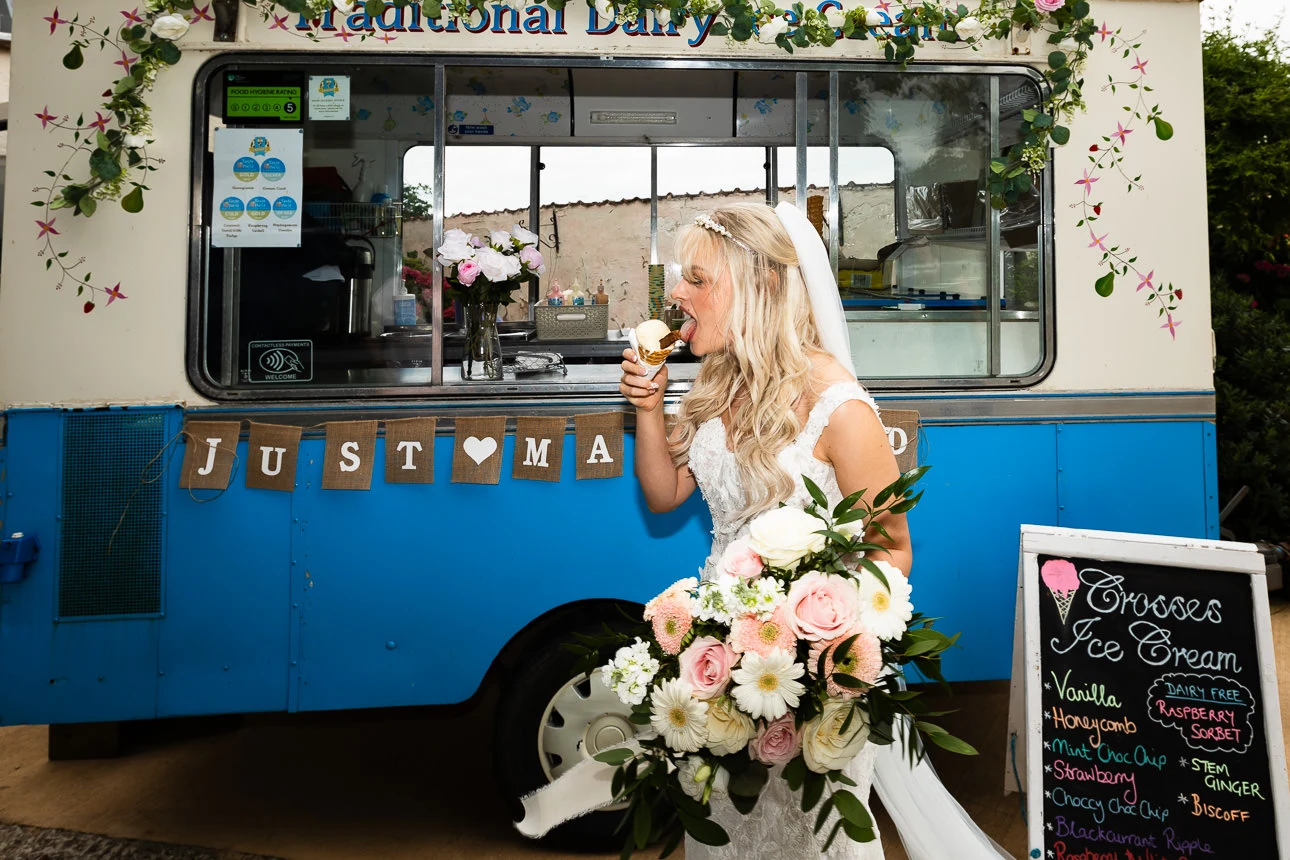bride eating ice cream at upton barn wedding venue