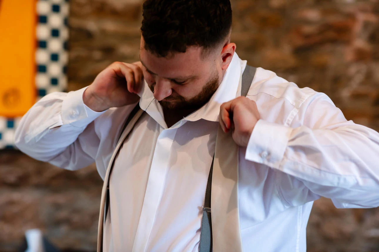 groomsman getting ready at Walton castle wedding venue