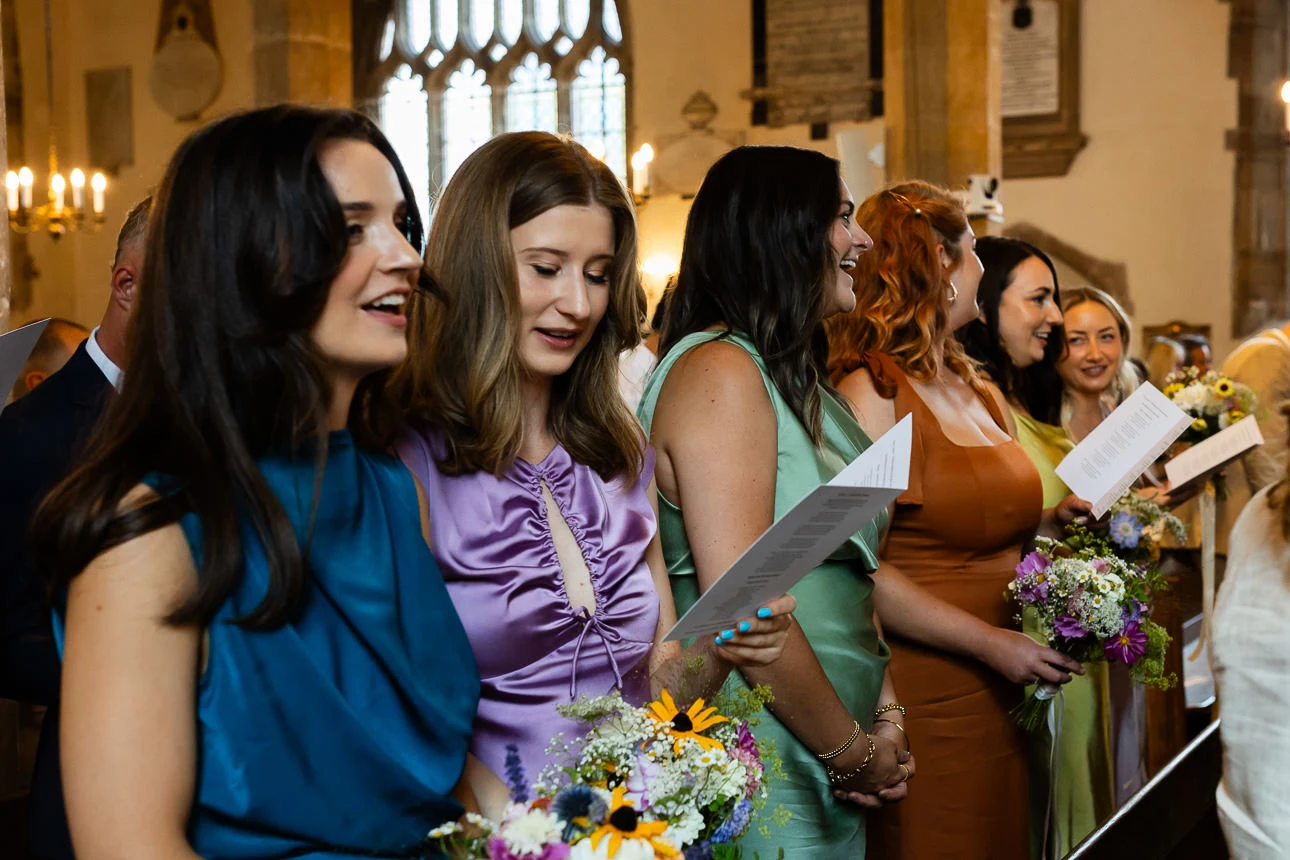 bridemaids singing at Walton castle wedding venue