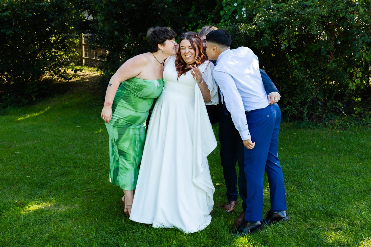 bride getting kissed at taunton wedding venue